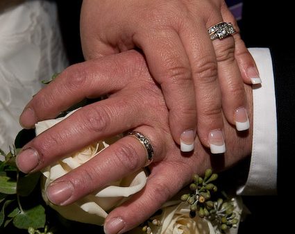 couple holding hands wedding